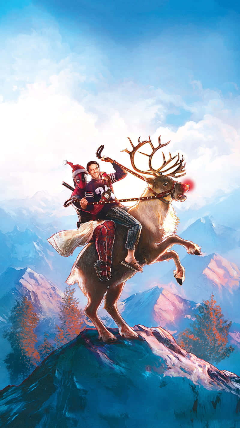 死侍和一個男人騎著馴鹿在白雪覆蓋的山頂上。