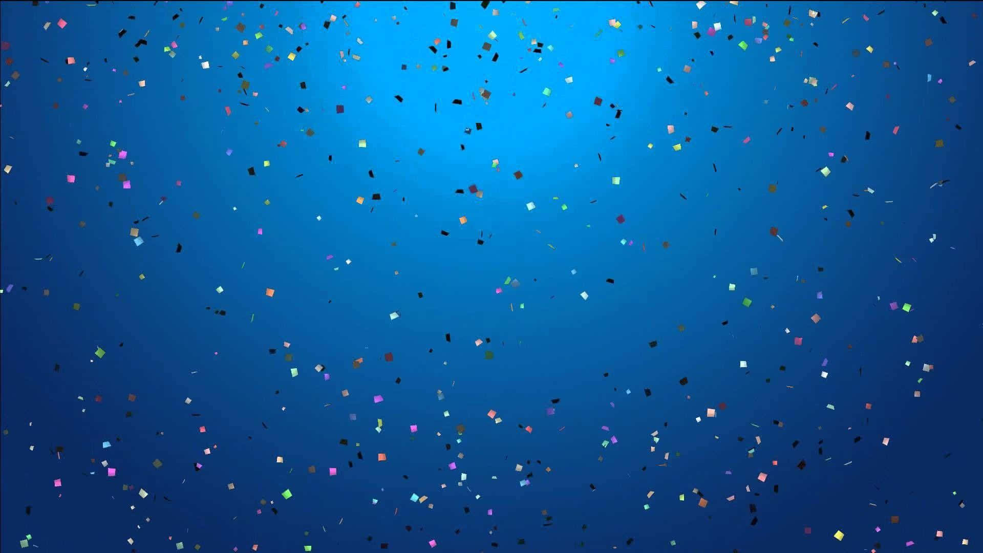 用繽紛藍色背景，為生日慶祝增添歡樂 壁紙 — 色彩繽紛的紙屑碎片漂浮在帶有柔和光線的漸變藍色背景上。