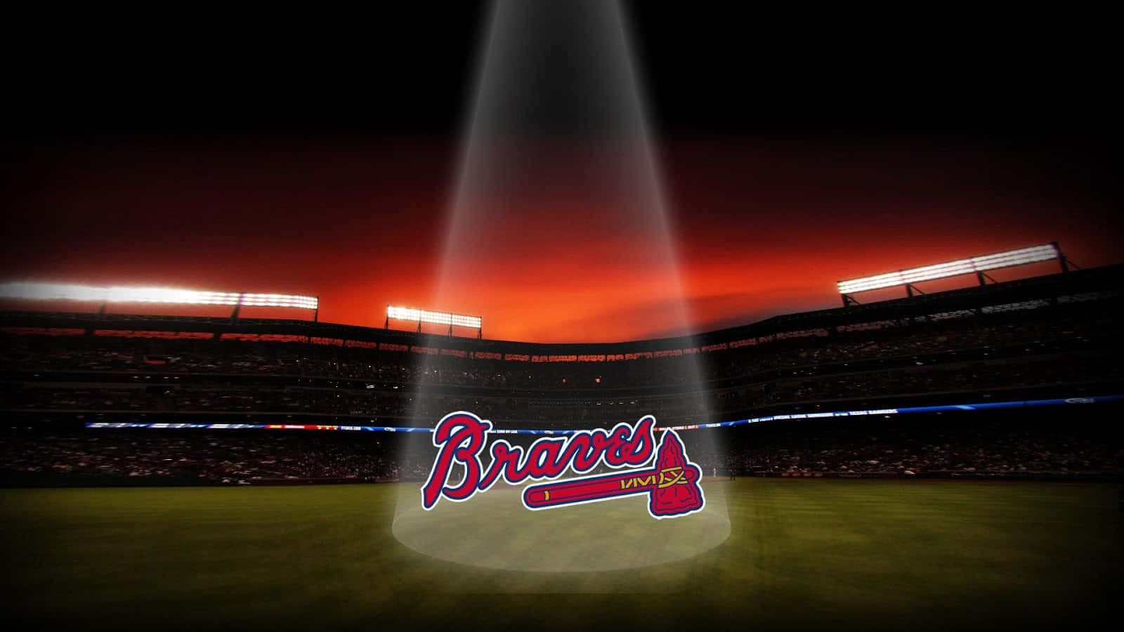 日落時分，Braves 棒球標誌在球場被聚光燈照亮。