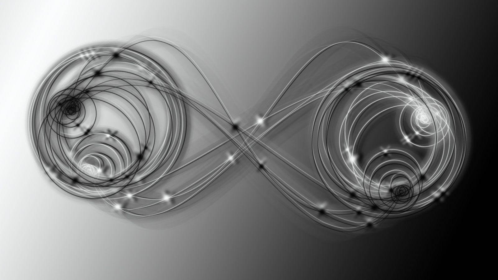 Infinity Symbol 桌布 壁紙 — 由發光旋轉線條和亮點在漸變灰色背景上形成的抽象無限符號。