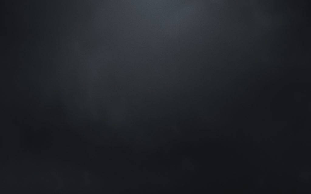 由黑漸變至灰的畫布 壁紙 — 一個深色紋理背景，帶有微妙的漸變和從中心向邊緣漸弱的柔和光線。