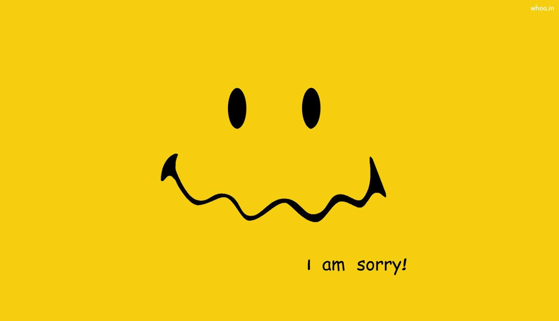 黃色背景上有一個黑色笑臉和寫著I am sorry的文字