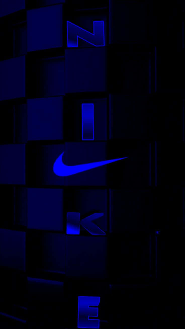 Blue Nike 桌布 壁紙 — 發光藍色Nike標誌從黑暗立方體中浮現，在未來數碼網格中。