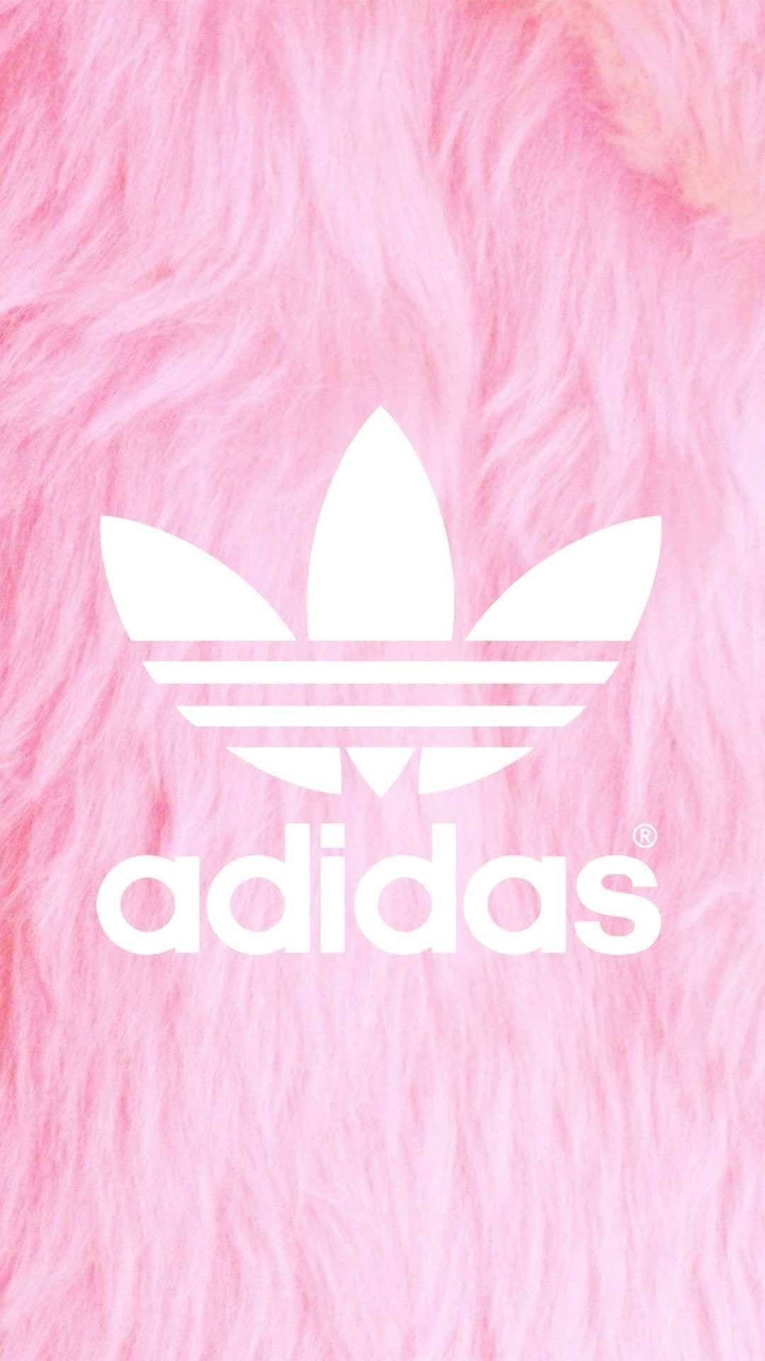 adidas 桌布 壁紙 — 白色adidas標誌居中在柔軟蓬鬆的粉紅色背景上。