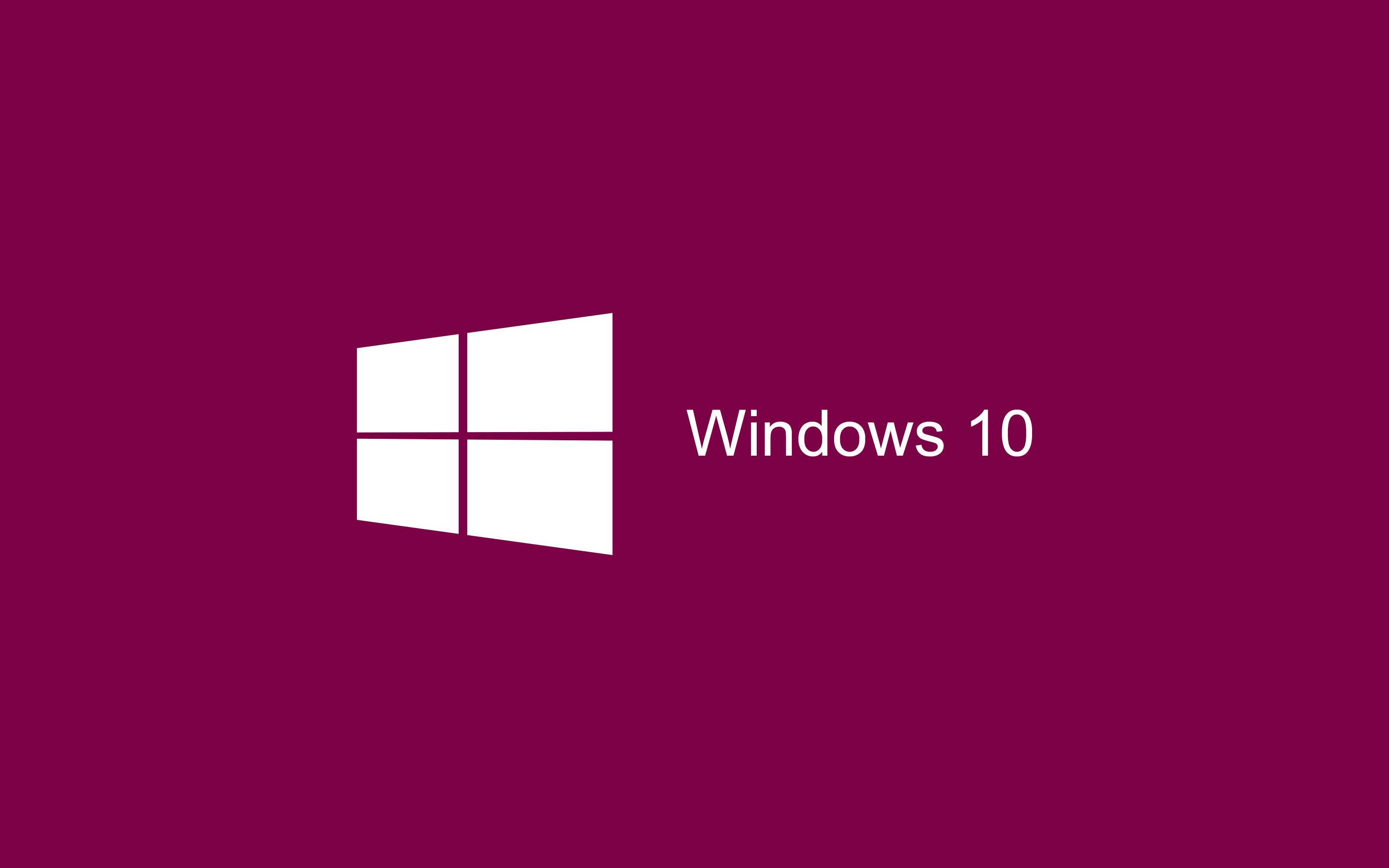 背景 桌布 壁紙 — 白色Windows 10標誌和文字居中在純深洋紅色背景上。