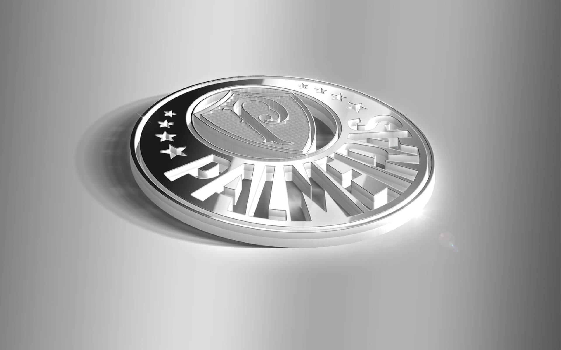 一枚金屬銀幣，表面浮雕有「PATRIOTS」和星星。
