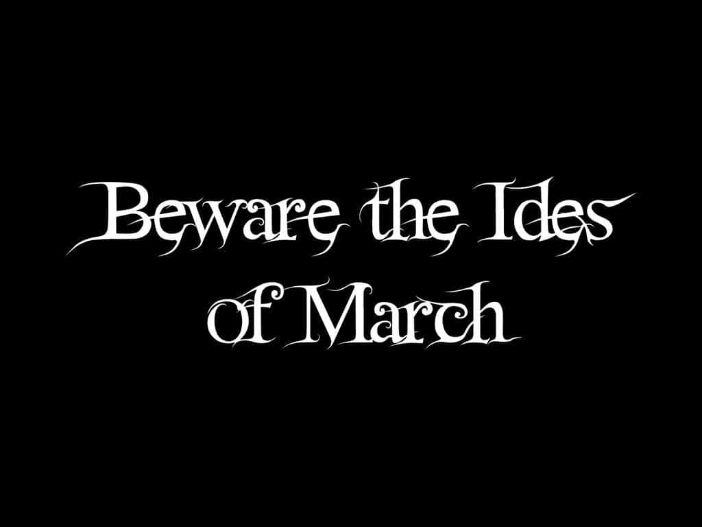 Ides Of March 桌布 壁紙 — 白色哥德式文字在純黑色背景上寫著「Beware the Ides of March」。