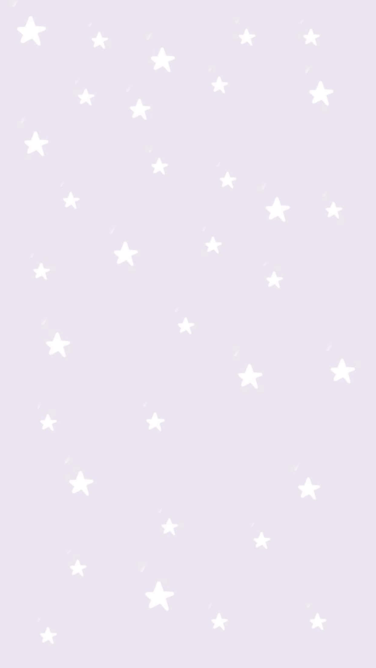 Pastel Cute 桌布 壁紙 — 白色星星在柔和的薰衣草背景上輕輕飄浮，營造出極簡的數位桌布。