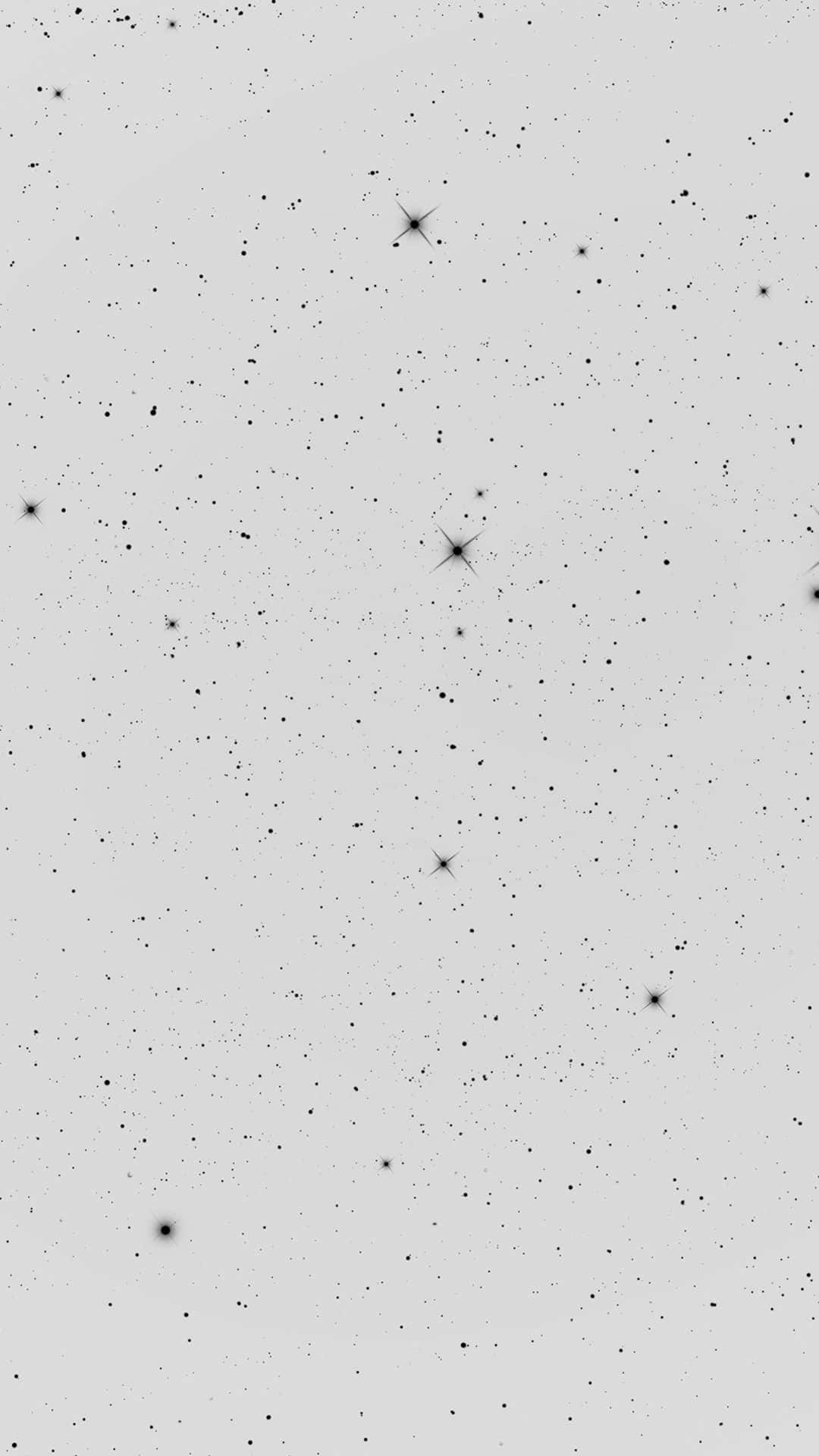 灰色背景上閃爍著星星的夜空。