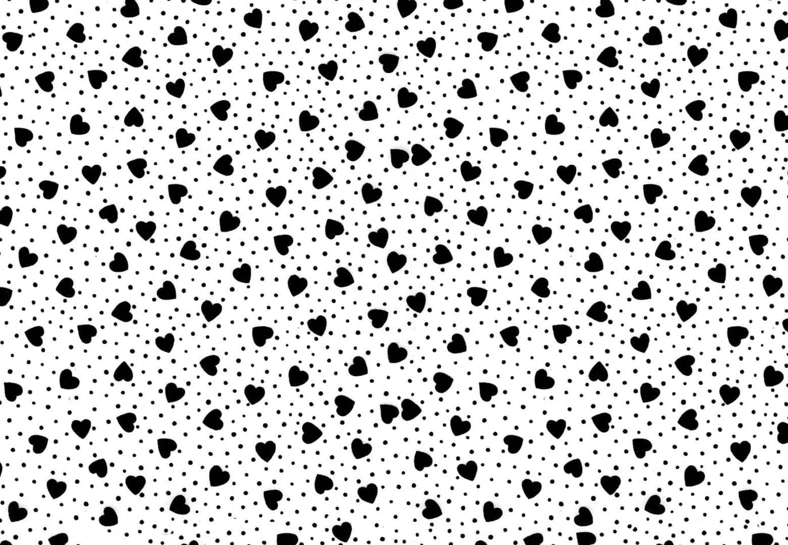 Black And White Dots 桌布 壁紙 — 白色背景上重複的黑色心形和圓點圖案，營造出俏皮浪漫的牆紙。