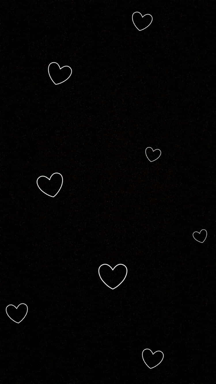 Aesthetic Black Heart 桌布 壁紙 — 白色輪廓心形在帶有紋理的黑色背景上以極簡數位藝術風格輕輕漂浮。