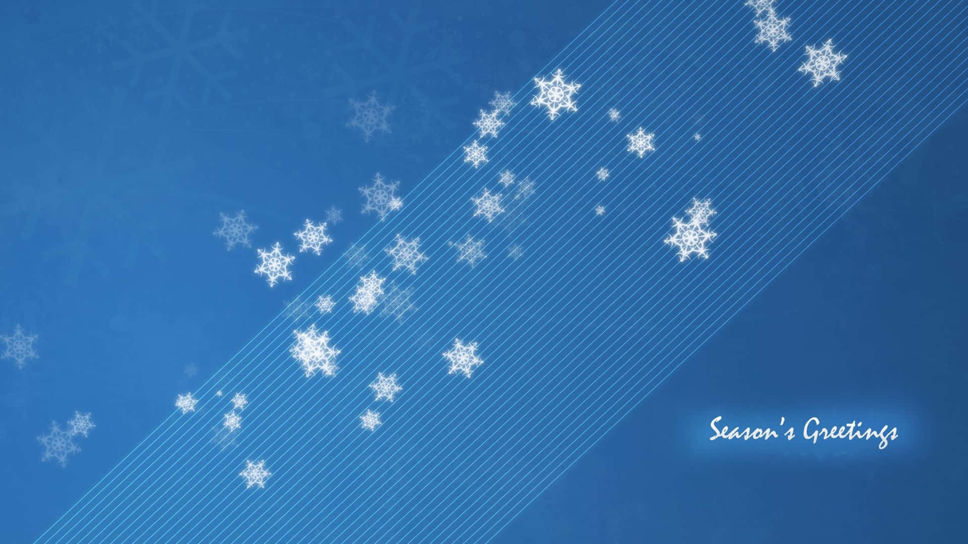Greetings 桌布 壁紙 — 白色雪花斜向飄落在帶有細微網格線和發光「Season's Greetings」文字的漸變藍色背景上。