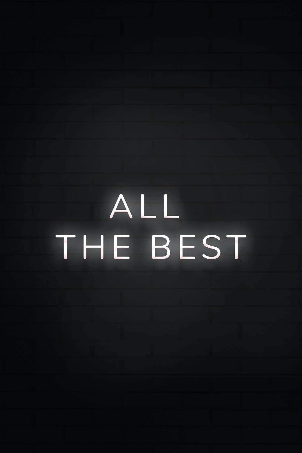 深色磚牆上寫著 all the best 的霓虹燈牌