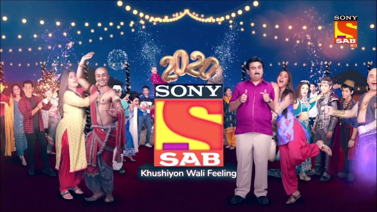 一群人在喜慶的Sony SAB 2020慶祝活動中跳舞，伴隨煙火和燈光。