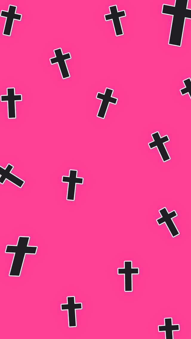 粉紅色背景上散落著帶白色輪廓的黑色十字架。