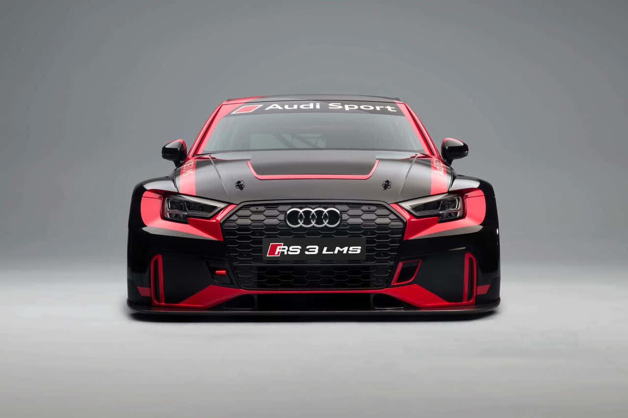 看看奧迪能為您提供什麼 壁紙 — 黑色和紅色 Audi RS 3 LMS 賽車的正面視圖，帶有 'Audi Sport' 品牌標誌，背景為中性灰色工作室。