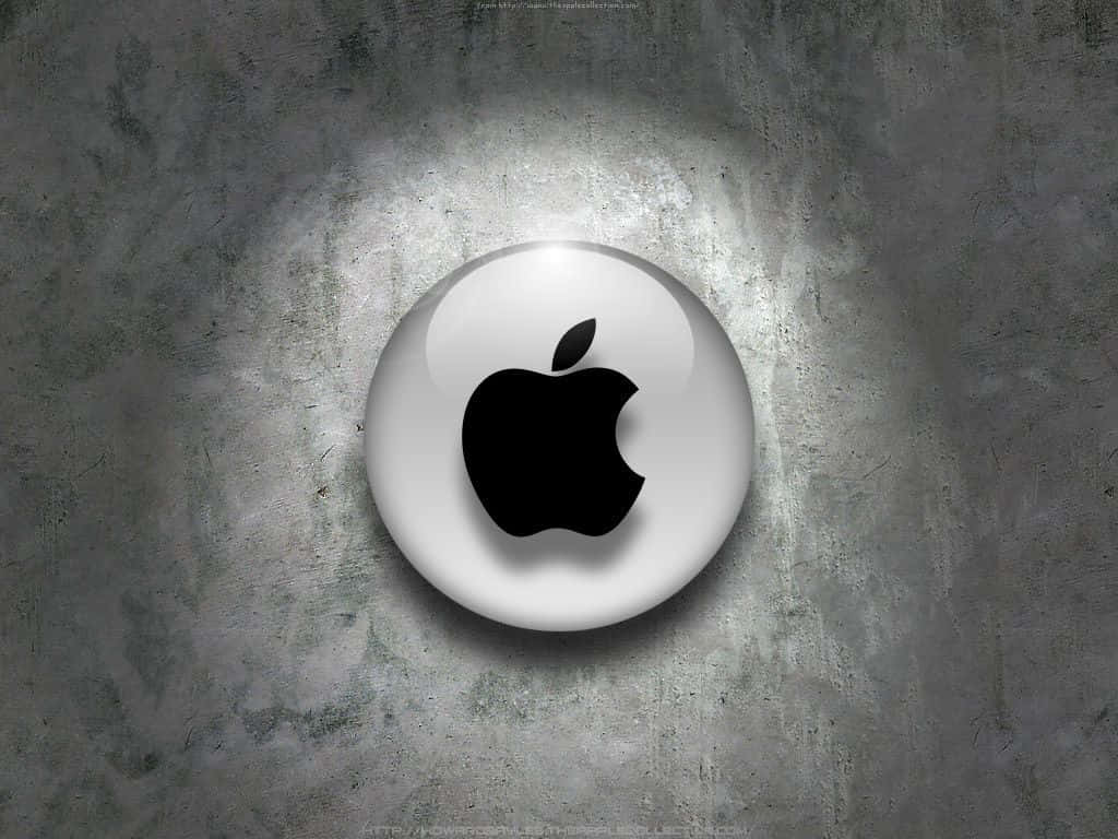 聚光燈下的紋理灰色混凝土牆上的光澤Apple標誌。
