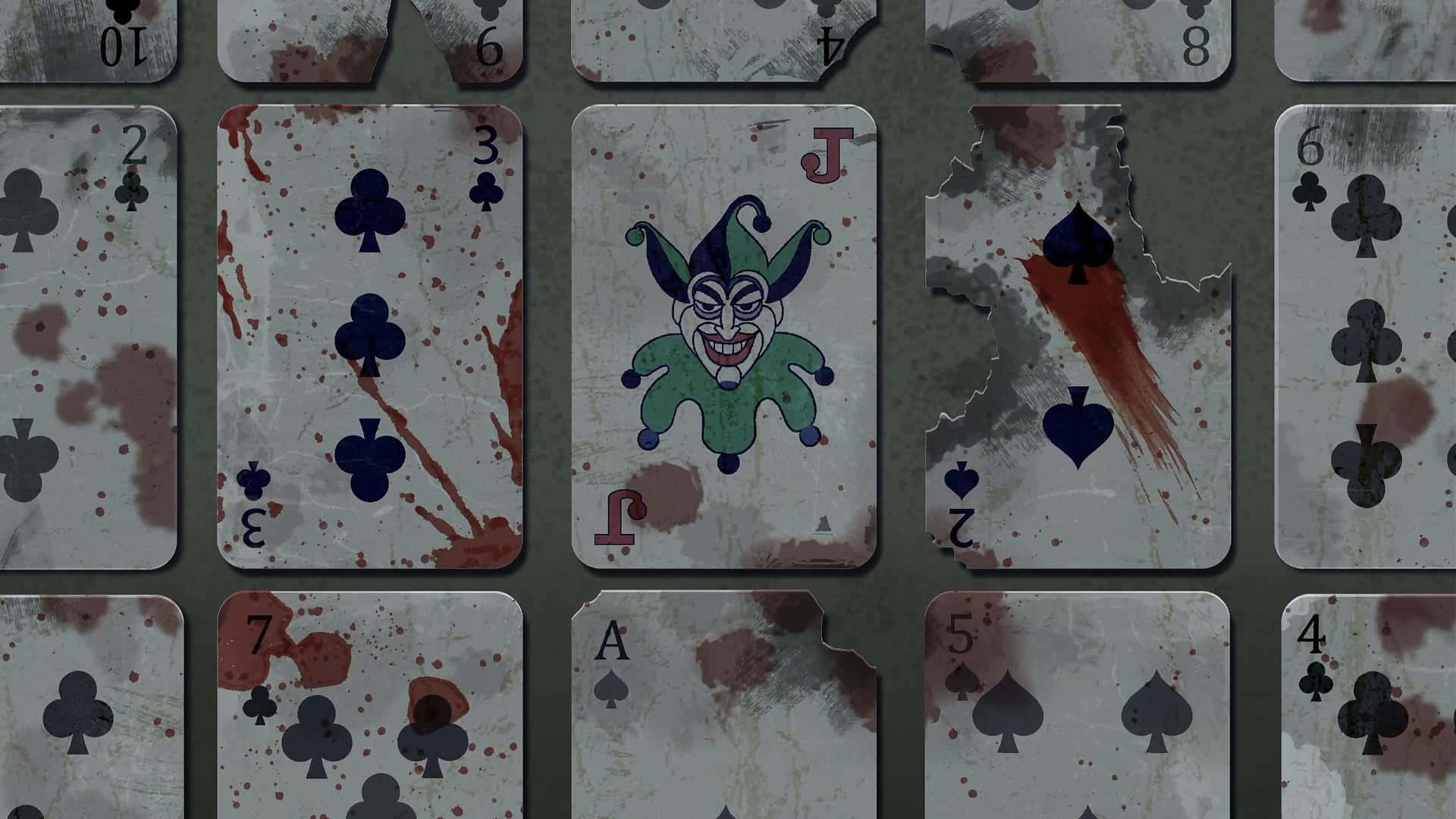 Joker Card 桌布 壁紙 — 破爛的撲克牌沾滿血跡，邊緣撕裂，排列成骯髒的網格。
