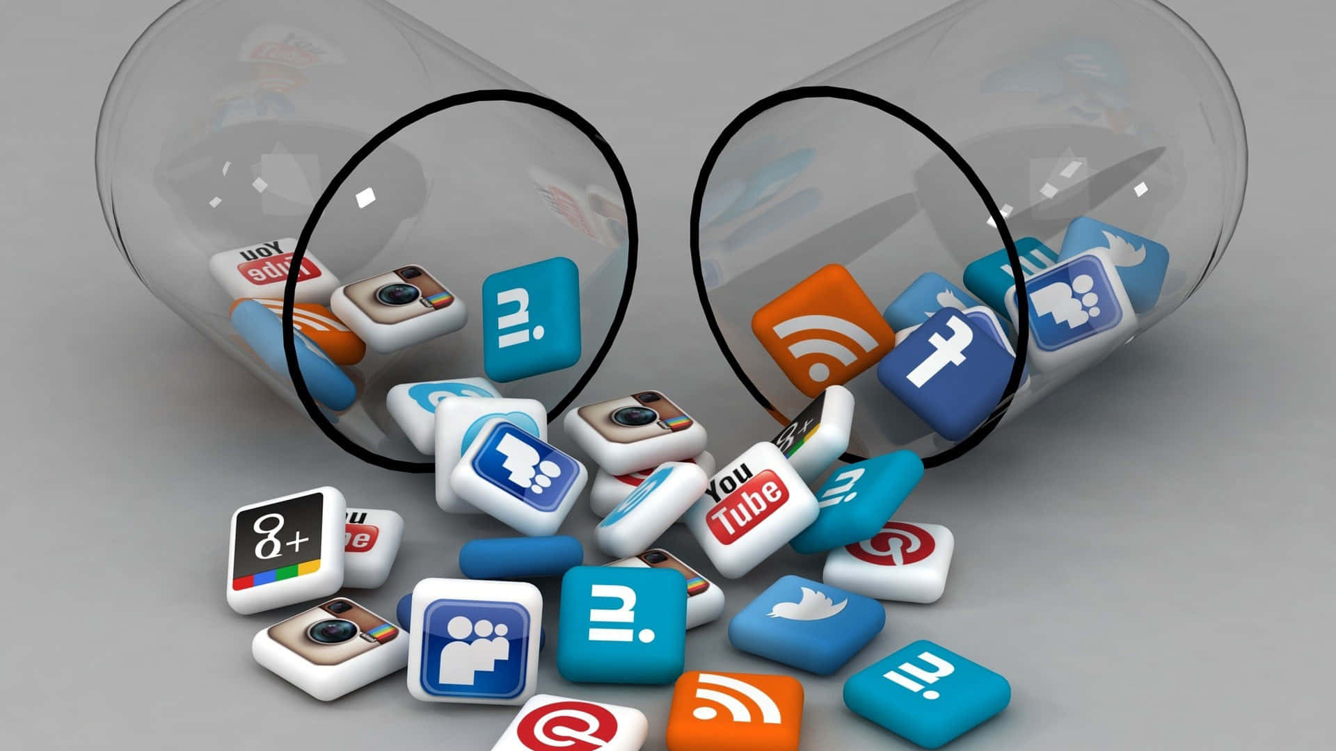Social Media Logos 桌布 壁紙 — 社交媒體應用程式圖示從翻倒的玻璃管中灑落在中性灰色表面上。