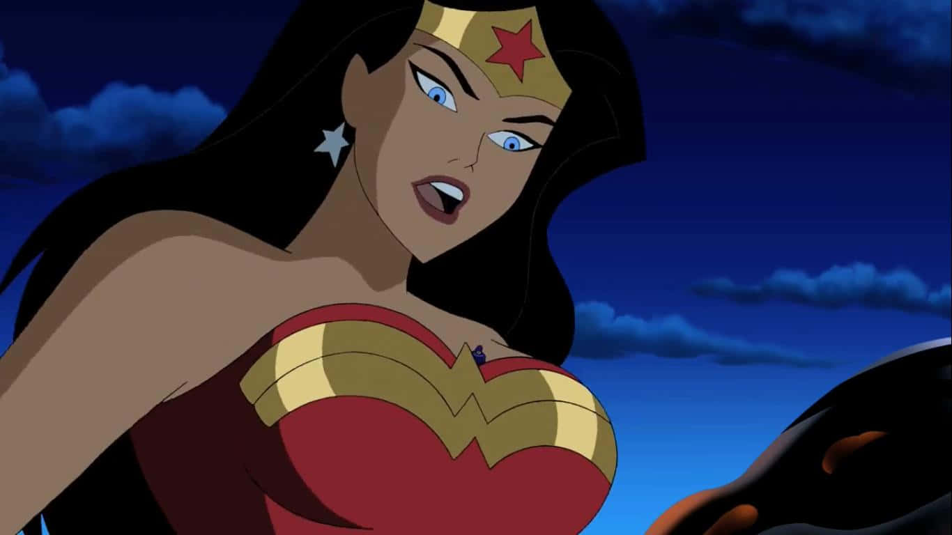 Justice League Unlimited 桌布 壁紙 — 神奇女俠身穿標誌性的紅金藍戰衣，在陰暗多雲的夜空下，帶著堅定的表情站立。