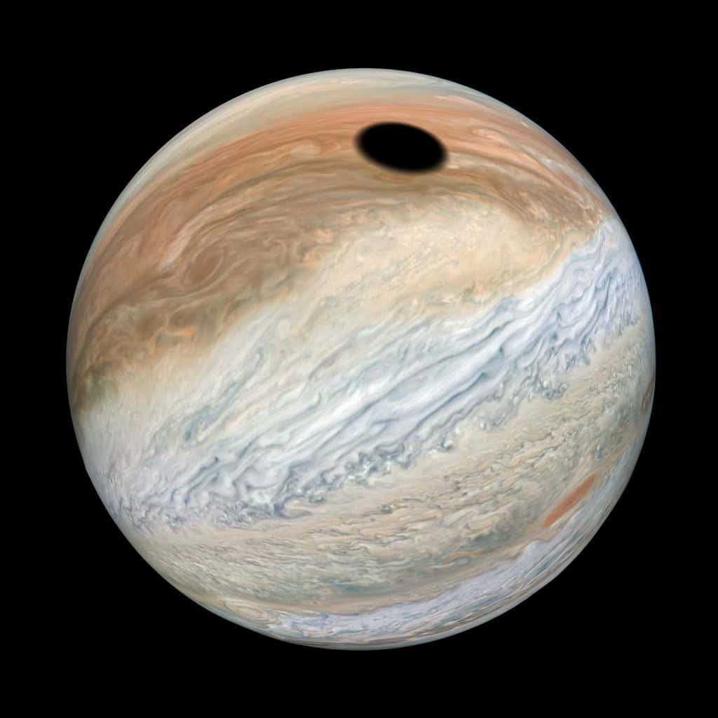 木星在太空中帶有旋轉雲層和橫跨表面的陰影。 — 木星 GIF 壁紙