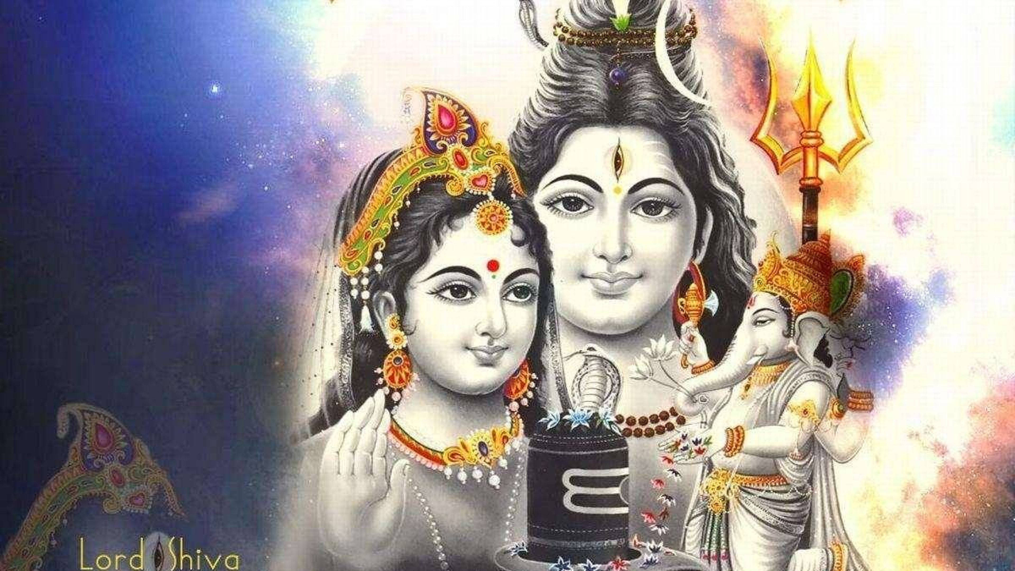 Lord Shiva 桌布 壁紙 — 神聖的印度教神祇濕婆與帕爾瓦蒂，飾以精緻珠寶，背景為宇宙，包含象頭神與三叉戟。