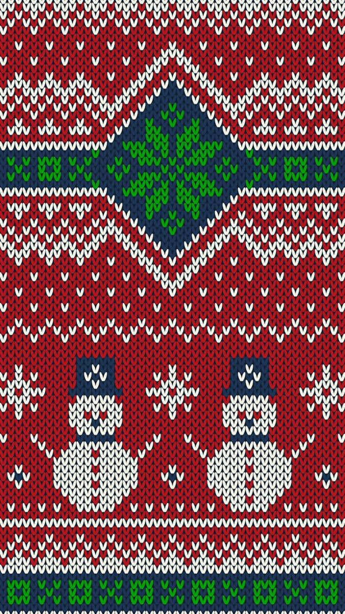 穿紅色毛衣的兩個雪人 壁紙 — 經典節日設計的紅色針織毛衣圖案，帶有雪人和綠色雪花。