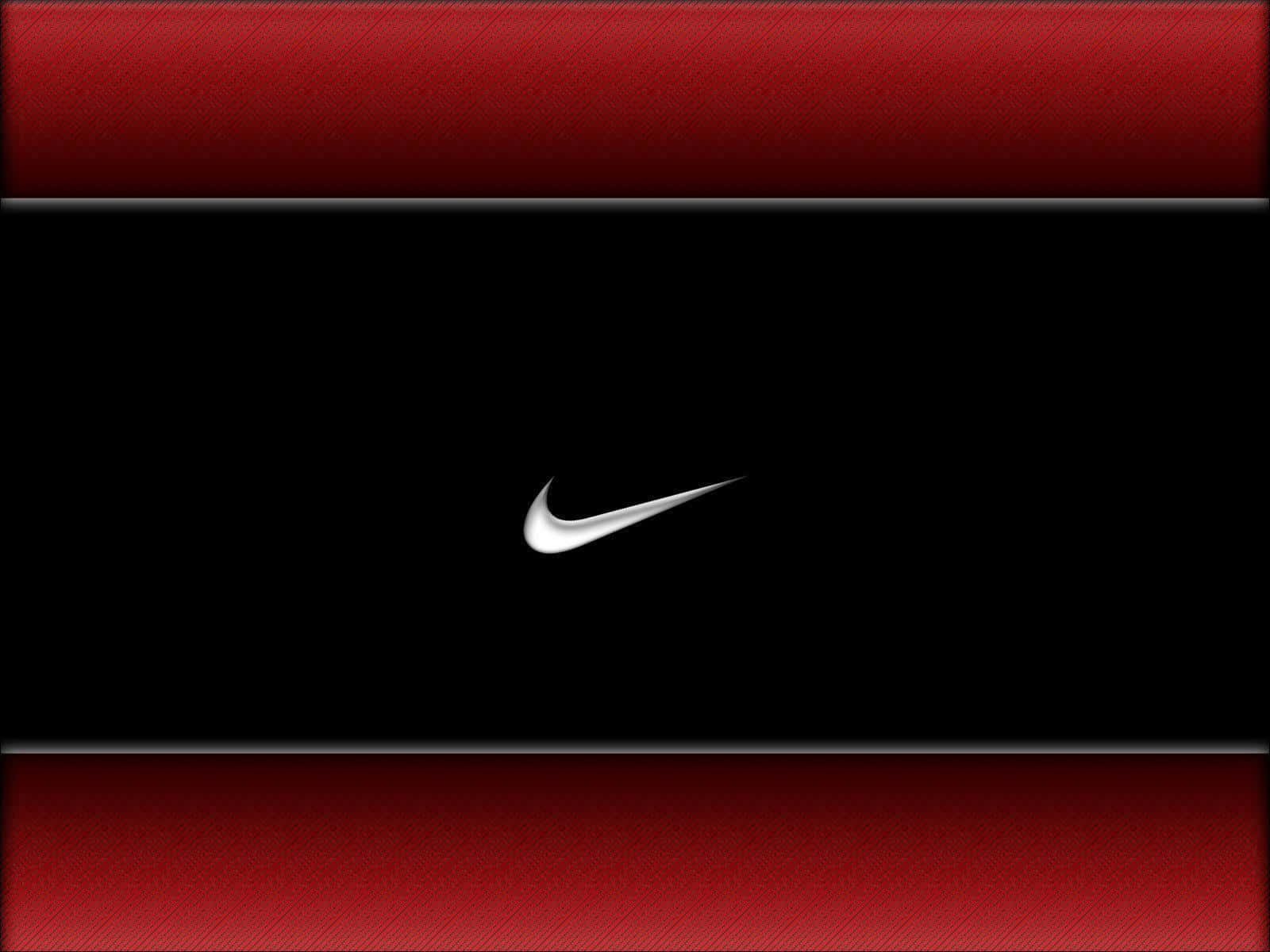 穿著紅色Nike展現時尚 壁紙 — 一個時尚的銀色Nike勾號居中於黑色背景上，並由帶紋理的紅色條帶框住。
