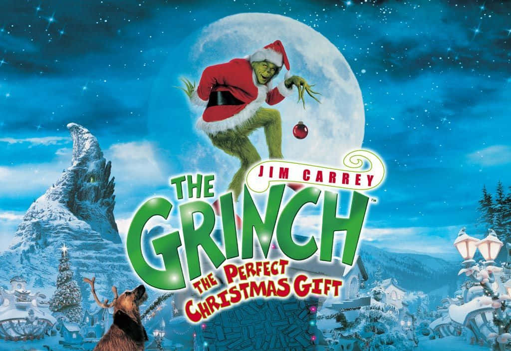 The Grinch 桌布 壁紙 — 穿著聖誕老人服的鬼靈精在滿月襯托下跳越積雪的胡維爾，下方有馴鹿。