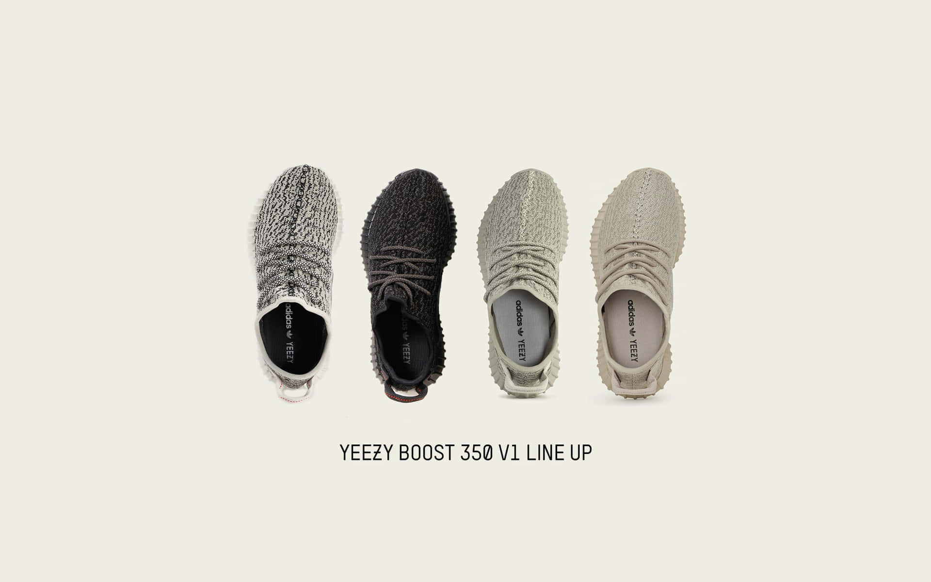 從上方看到四對不同顏色的Yeezy Boost 350 V1運動鞋。