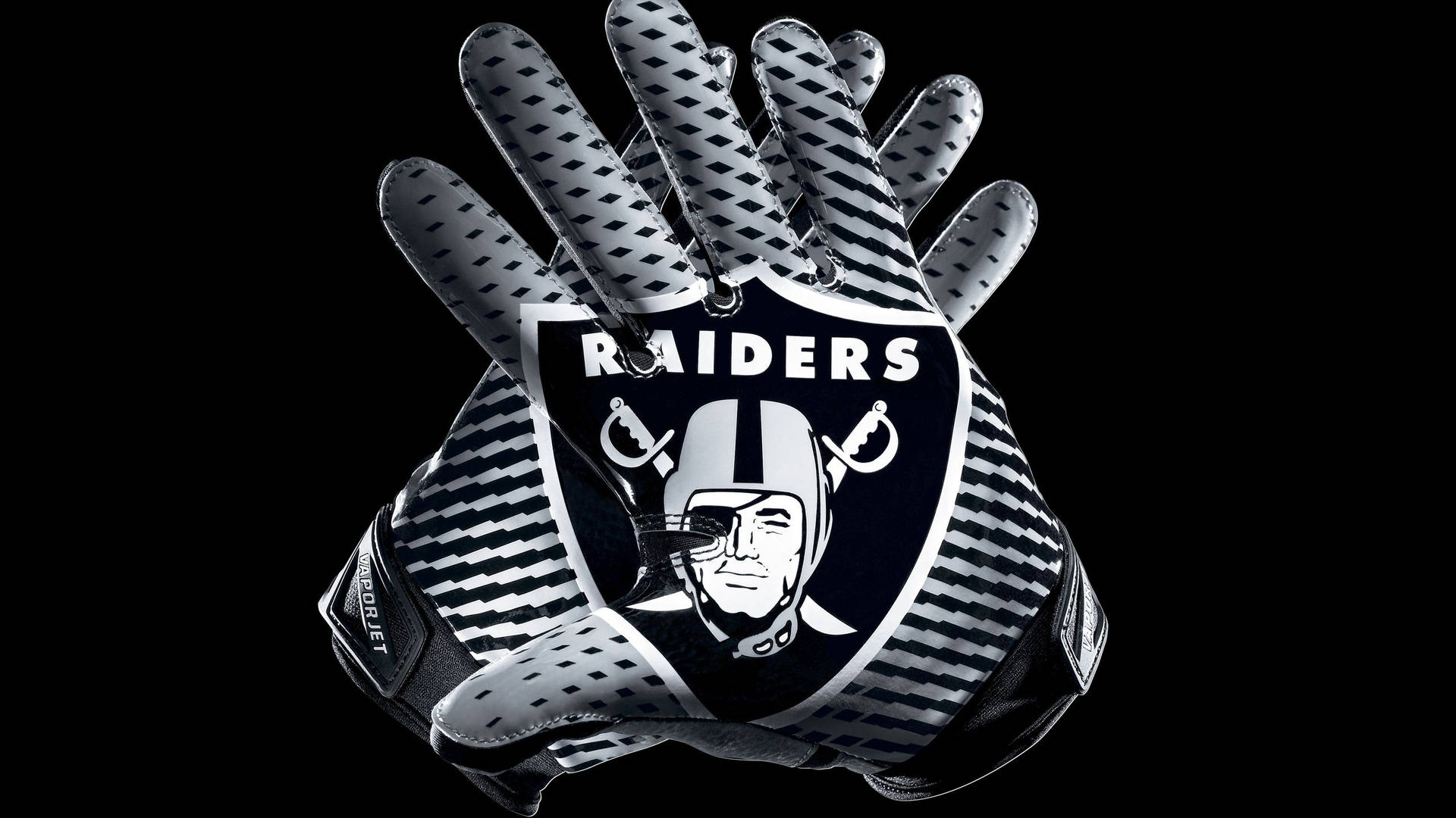 Raiders 美式足球手套，帶有球隊標誌，黑色背景