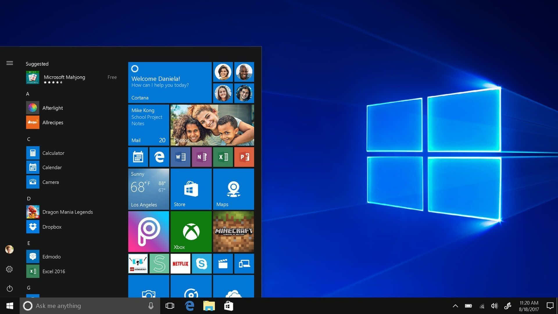 Windows 10 開始功能表在帶有發光視窗標誌的藍色漸變桌面上打開。
