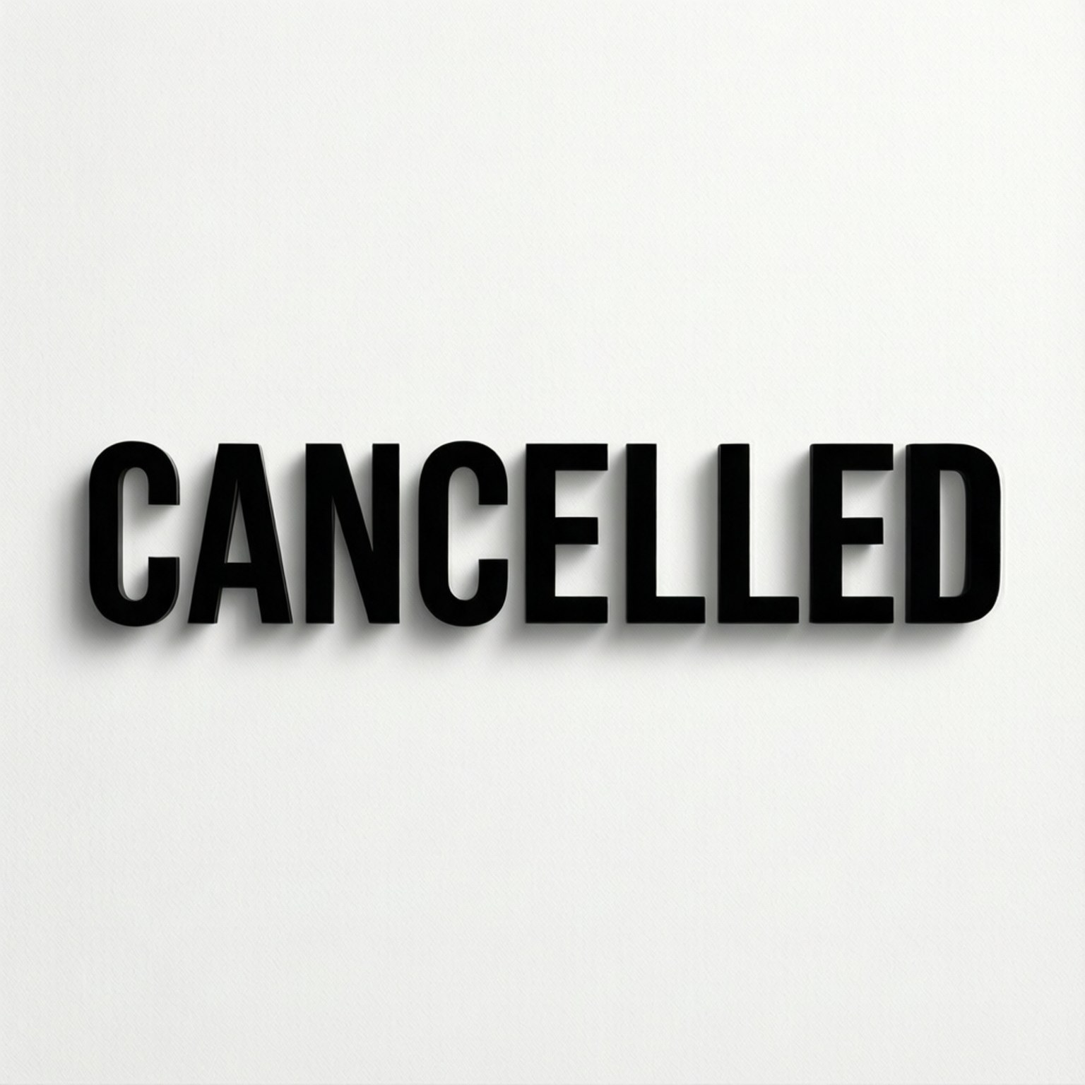 白色牆上以粗體黑色3D字母顯示的cancelled一詞。