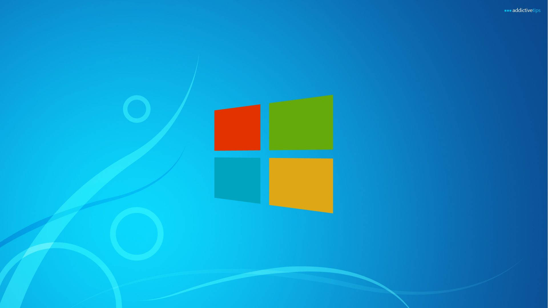 簡約 Windows 10 壁紙 — 充滿活力的藍色壁紙，帶有標誌性的Windows標誌、旋轉的光線圖案和漸變陰影。