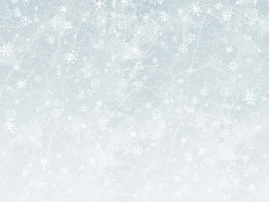 雪花飄落在霜藍色紋理冬日背景上。