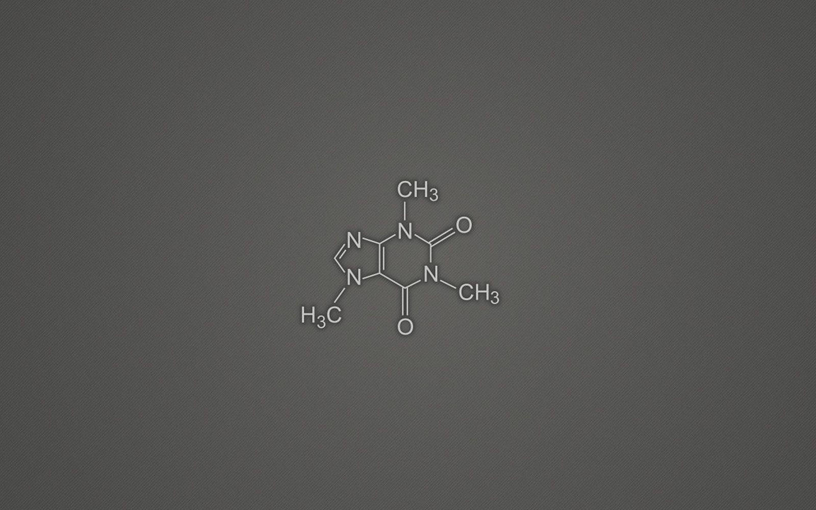 灰色紋理背景上的咖啡因分子結構圖