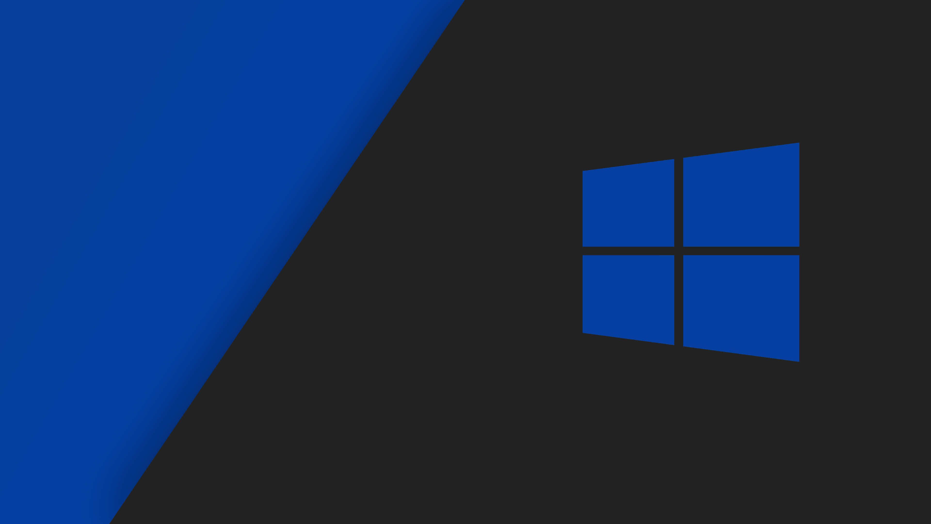 簡約時尚的 Windows 10 壁紙 — 一個極簡的數位桌布，在深灰色背景上帶有藍色Windows標誌和對角藍色漸變。