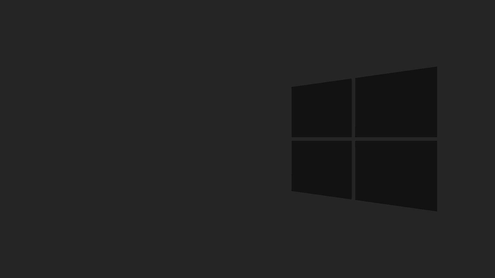 Dark Minimalist 桌布 壁紙 — 簡約深灰色牆紙，角落有微妙的Windows標誌剪影。