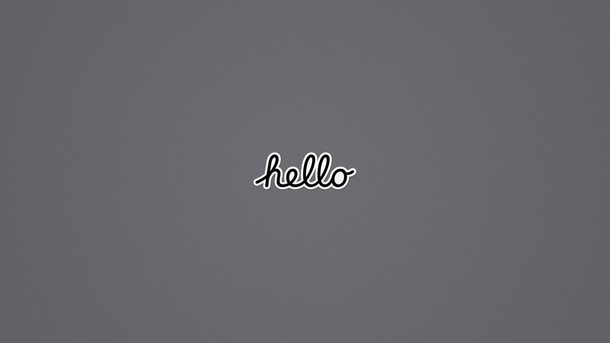 簡約灰底「Hello」橫幅 壁紙 — 白色草書字體「hello」居中顯示在純灰色背景上。