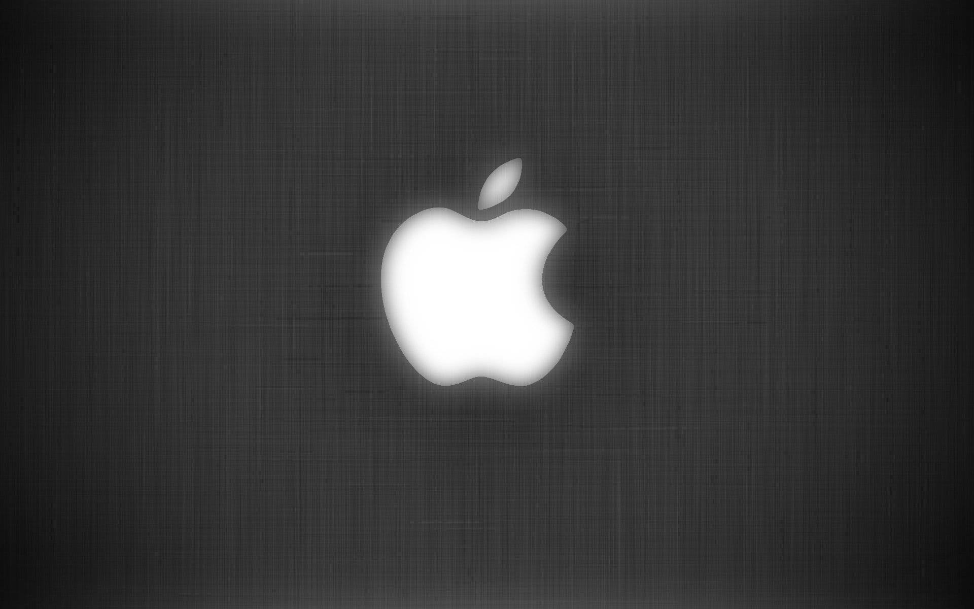 深色紋理背景上發光的Apple標誌