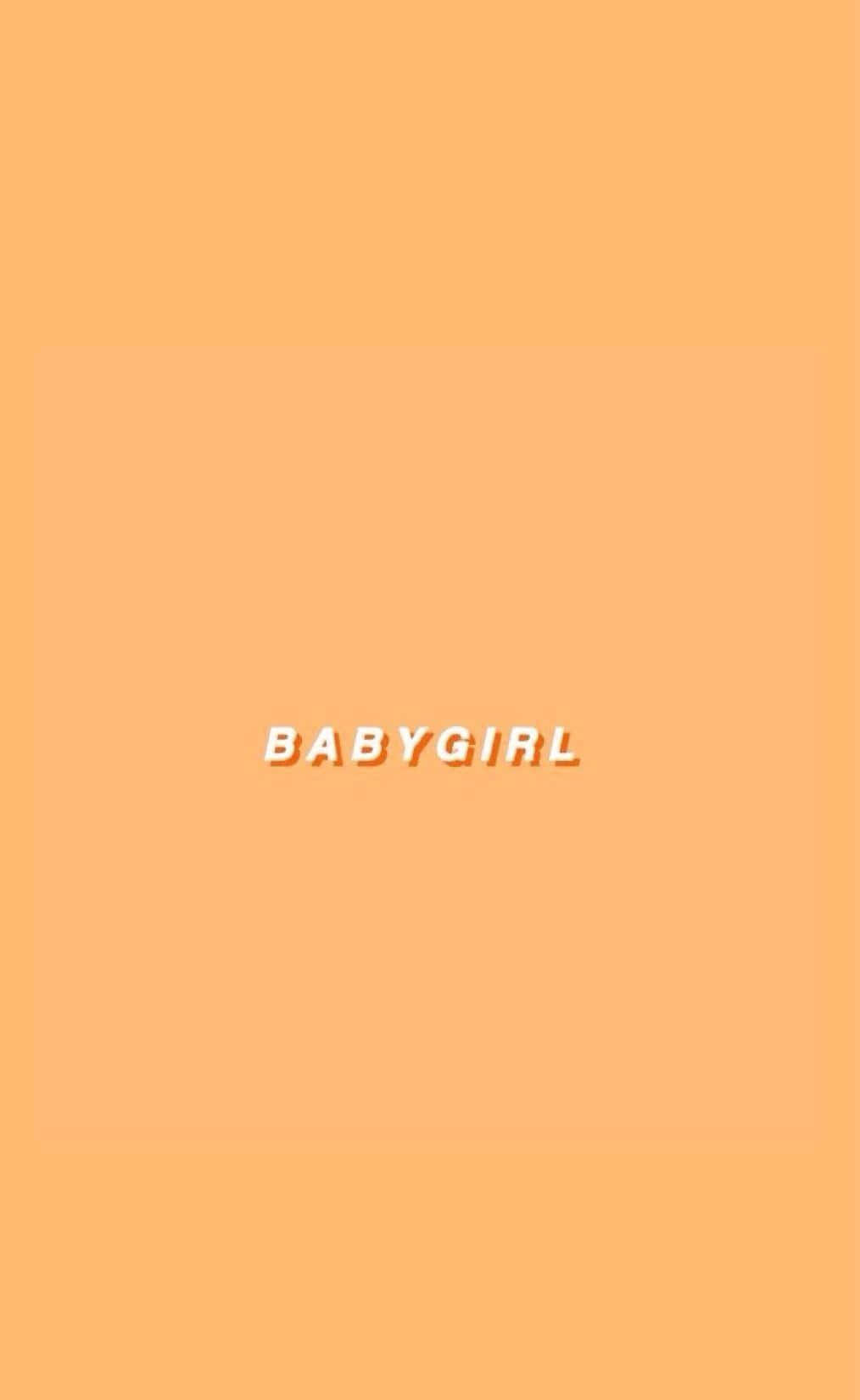 Soft Girl Aesthetic 桌布 壁紙 — 簡約蜜桃色背景，粗體白色3D文字BABYGIRL置中顯示。