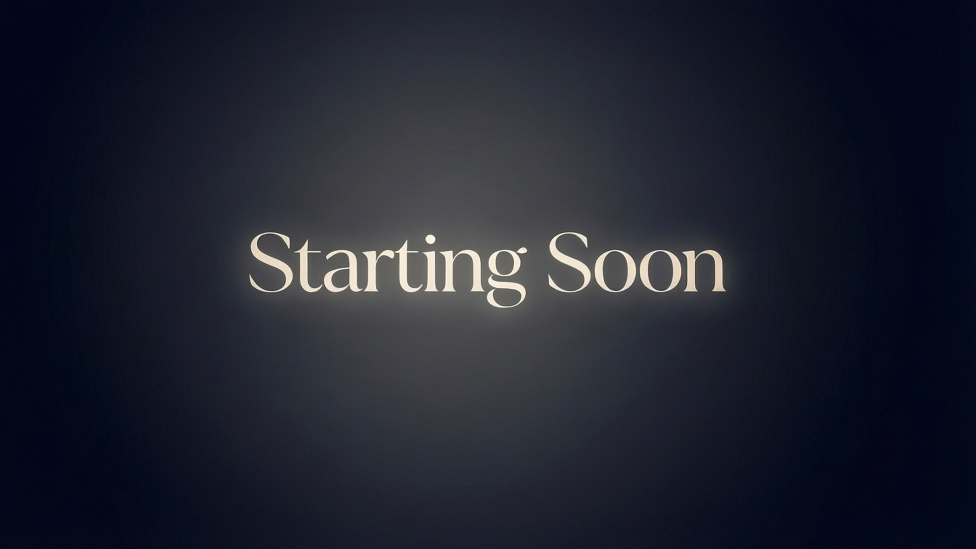 簡約風格「即將開始」 壁紙 — 「Starting Soon」一詞在深色漸變背景上以優雅的白色襯線字體柔和發光。