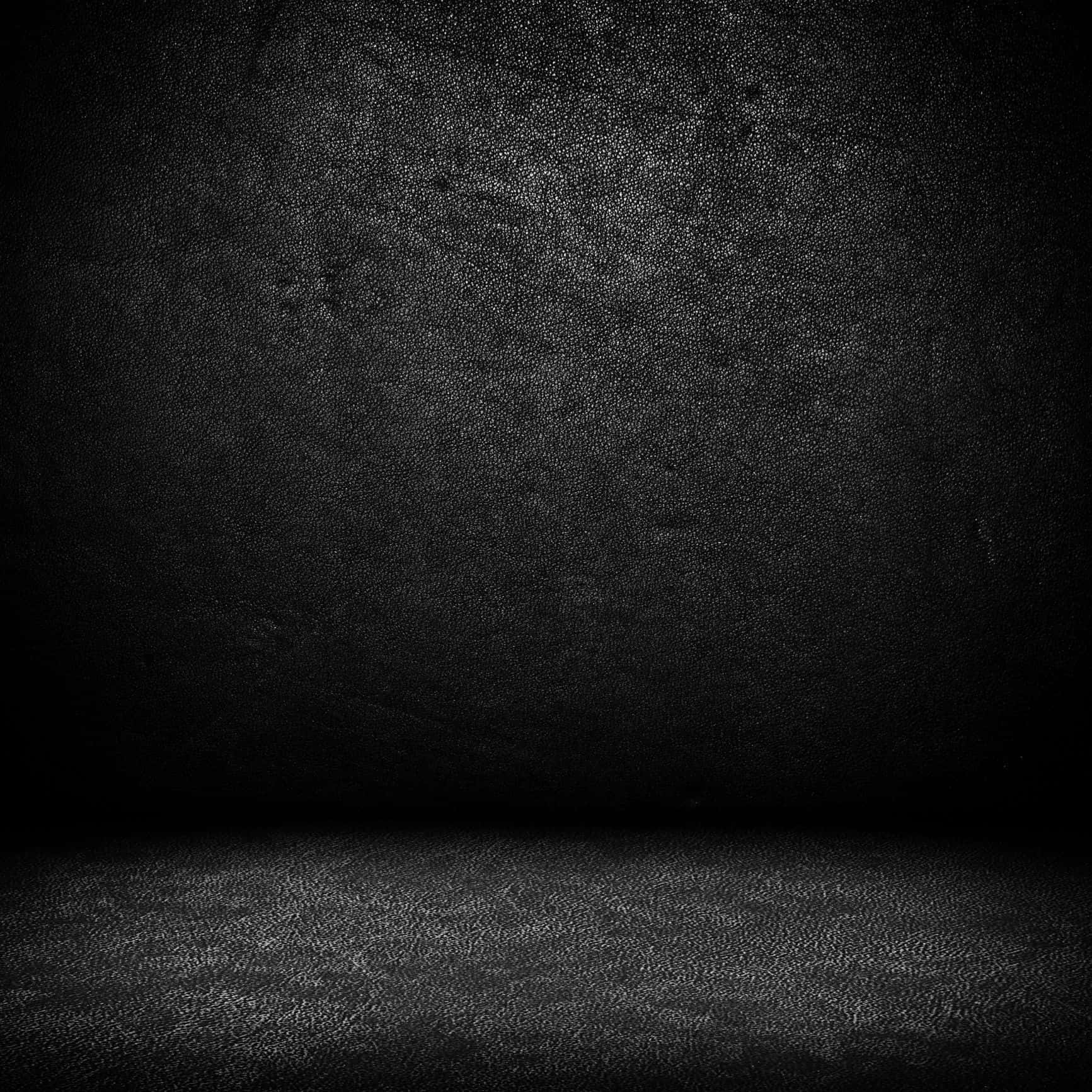 Dark Wall 桌布 壁紙 — 簡約黑色紋理工作室牆壁和地板，帶有微妙的漸變燈光。