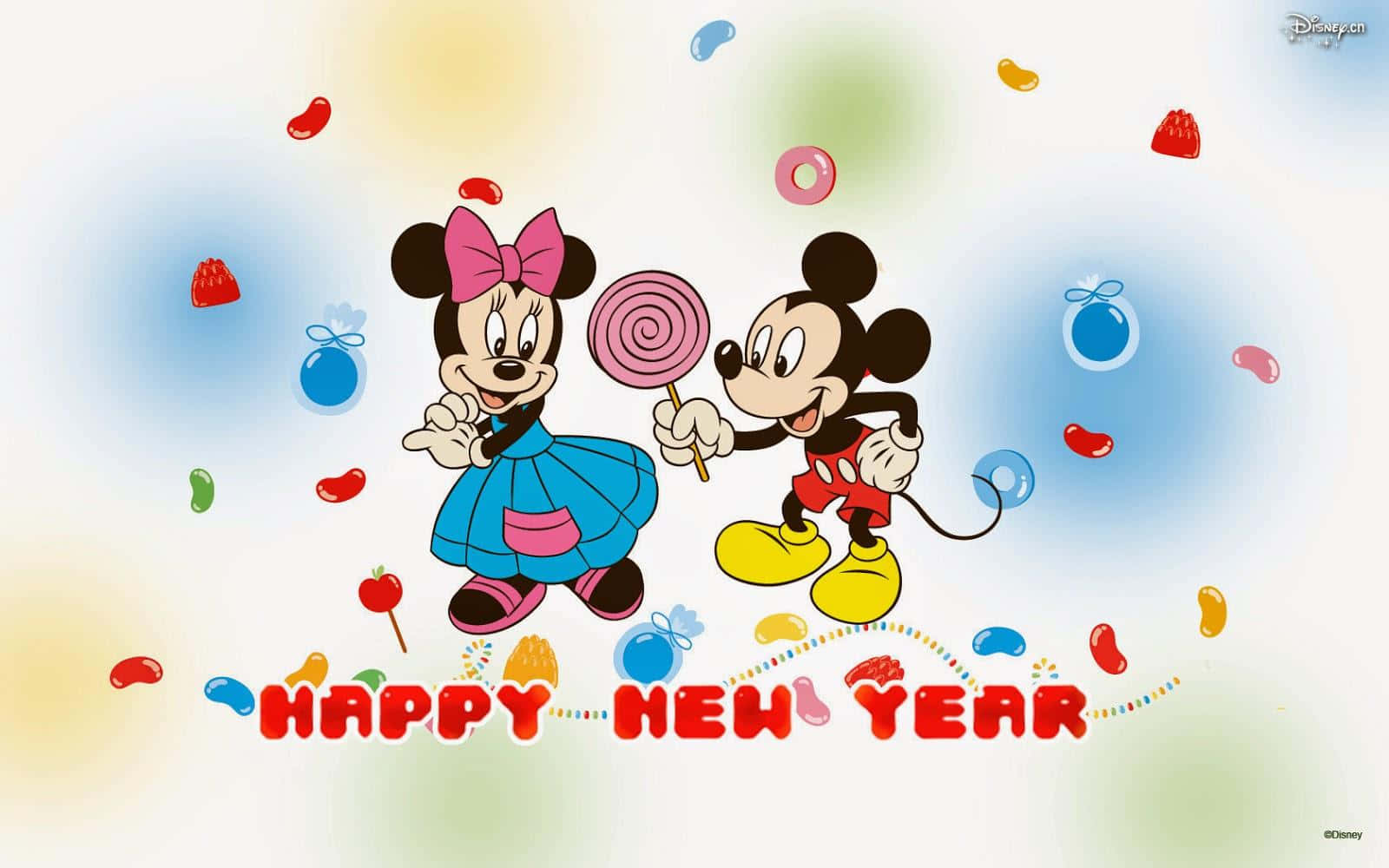 米奇和米妮老鼠用糖果和五彩紙屑慶祝新年。