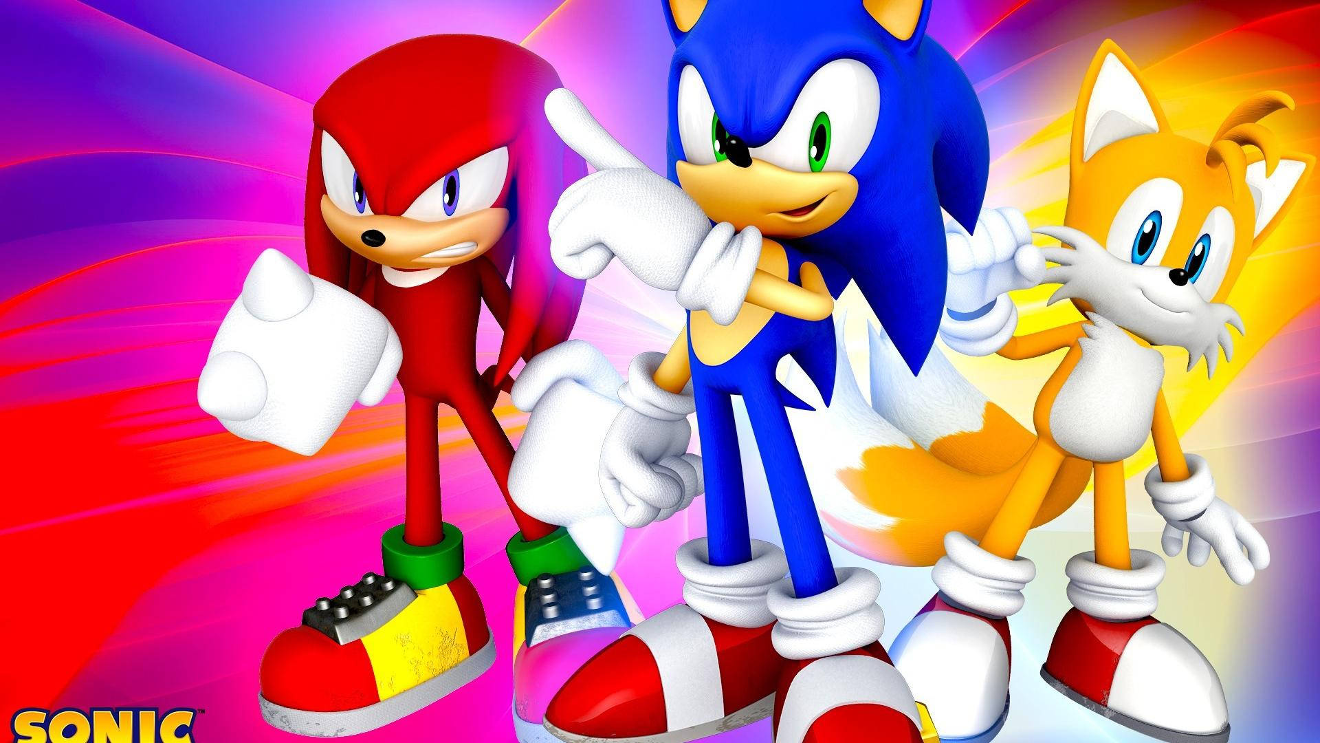 Sonic、Knuckles 和 Tails 以英雄姿態站立，身後有色彩繽紛的能量條紋。