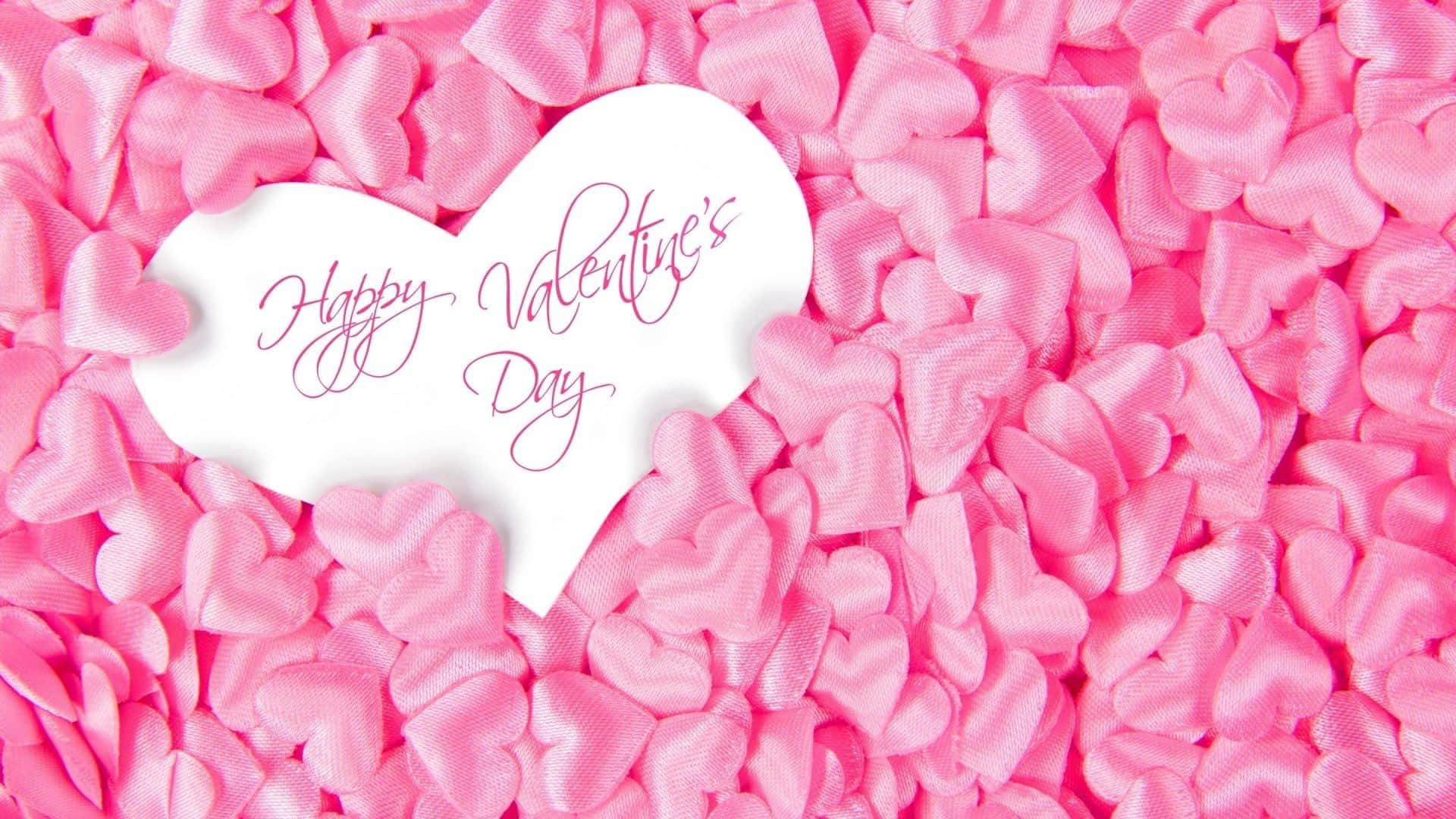 白色心形帶有Happy Valentine's Day文字，被粉紅色心形包圍。