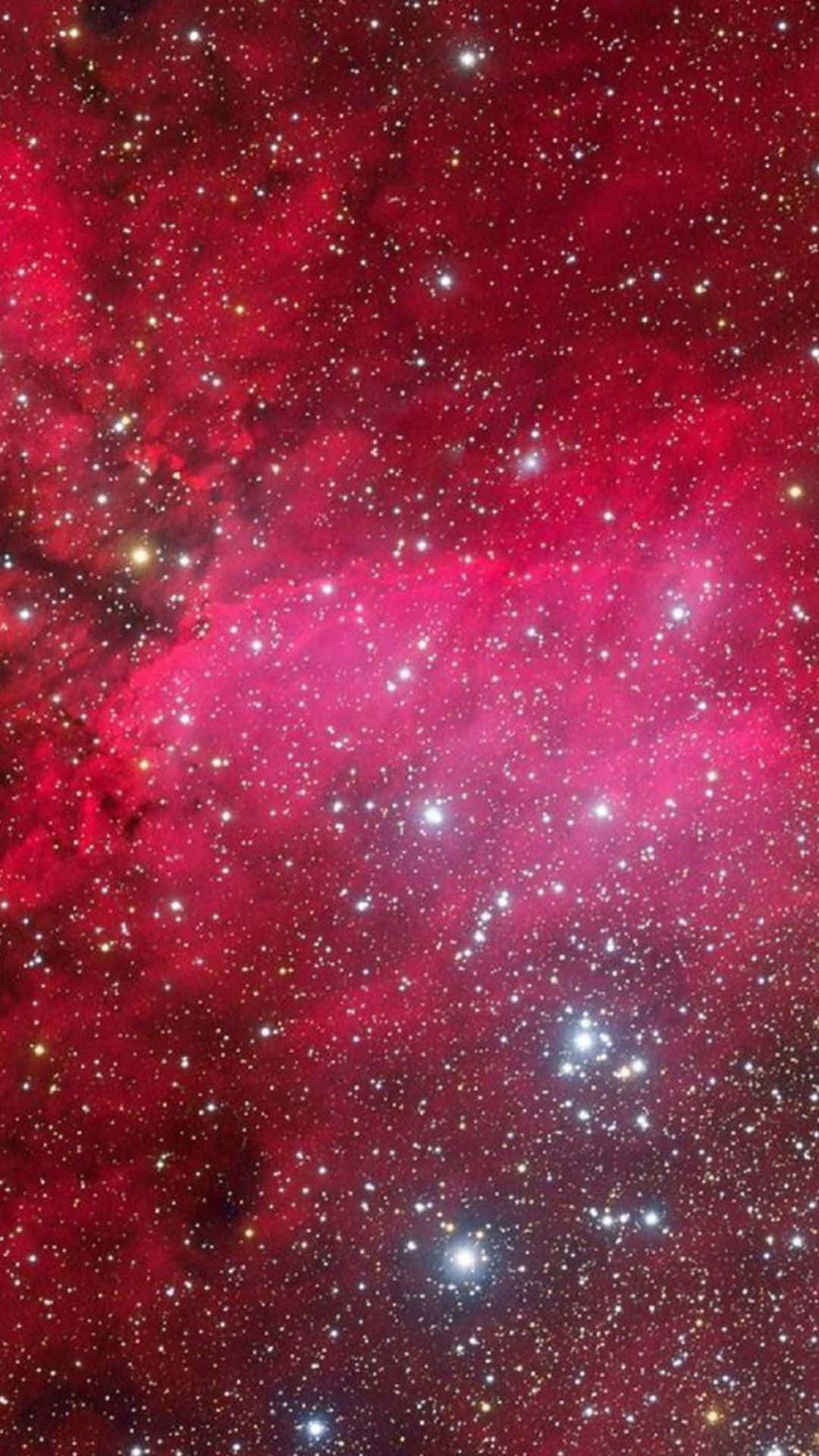 粉紅星雲——繽紛粉白星系的壯麗景象 壁紙 — 鮮豔的紅色宇宙星雲，在深邃的太空背景下閃耀著散落的明亮星星。