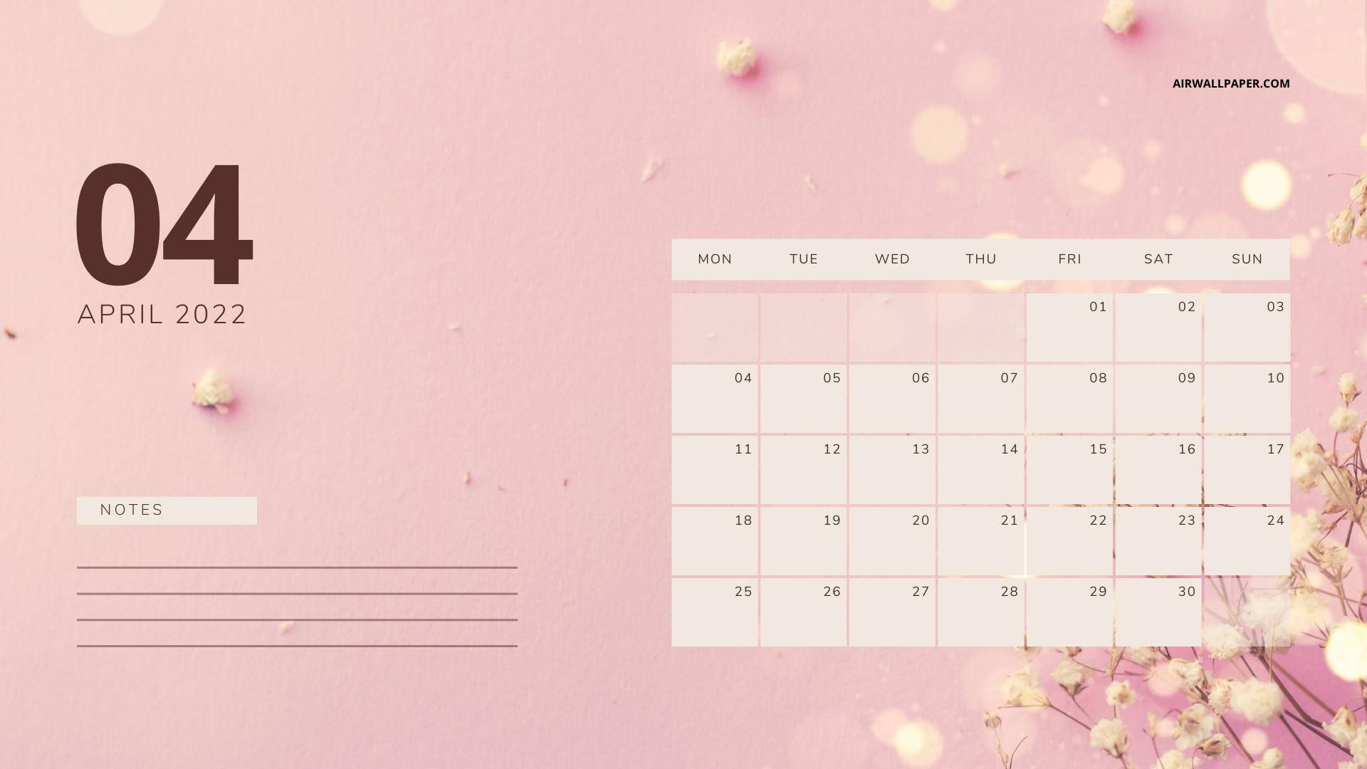 2022年4月月曆，帶有滿天星花朵和散景燈光，粉紅色背景。