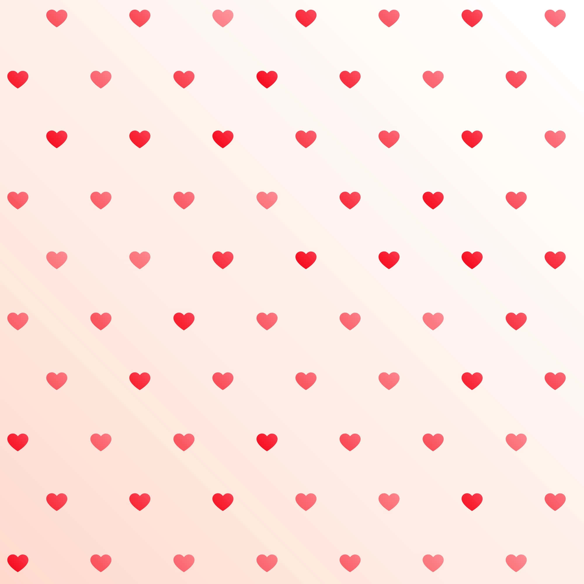 Heart Pattern 桌布 壁紙 — 粉紅與白色的柔和漸變背景，點綴著散落的紅色和粉紅色心形重複圖案。