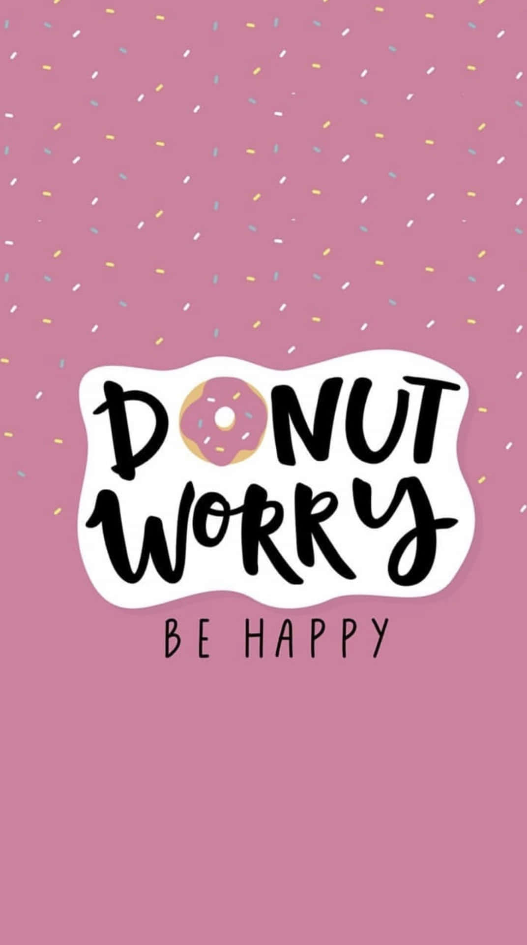 Happy iPhone 桌布 壁紙 — 粉紅色背景，配有彩色紙屑和一個有趣的「DONUT WORRY BE HAPPY」文字，其中冬甩取代了字母O。